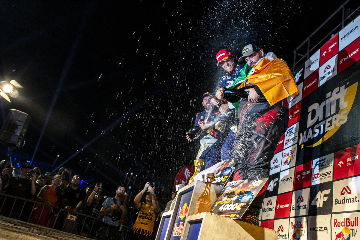 Champagne spray on the Drift Masters podium with the Irish tricolour